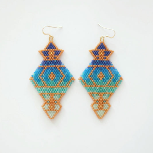Pair of geometric beaded earrings on a white background