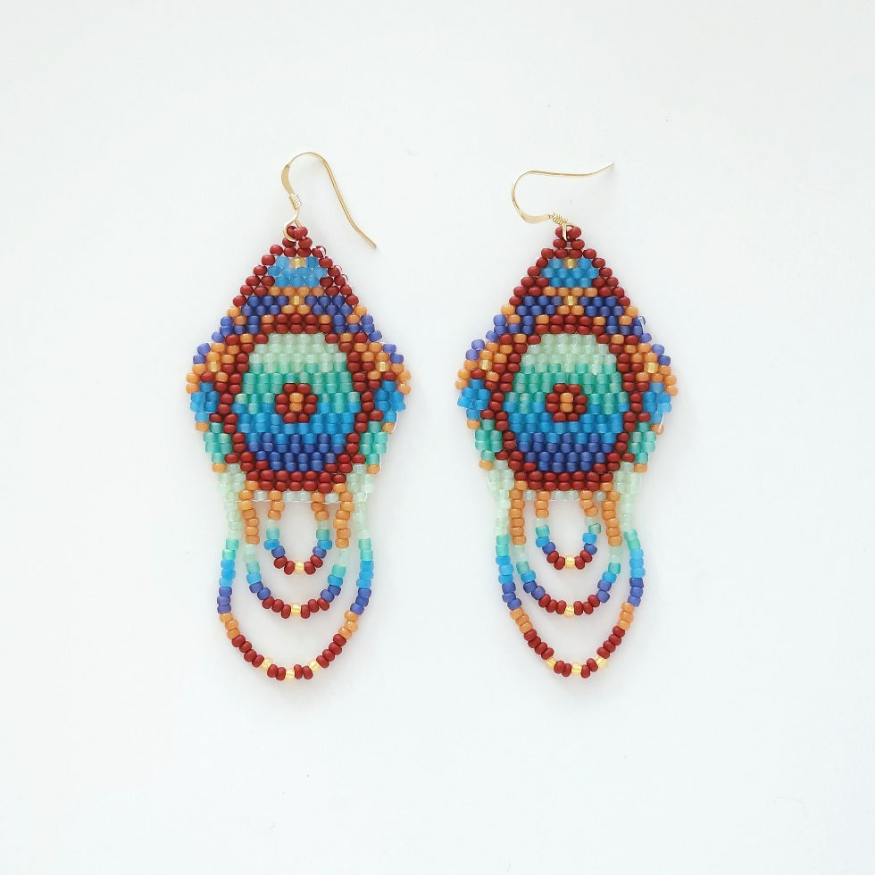 Colorful beaded earrings on a white background