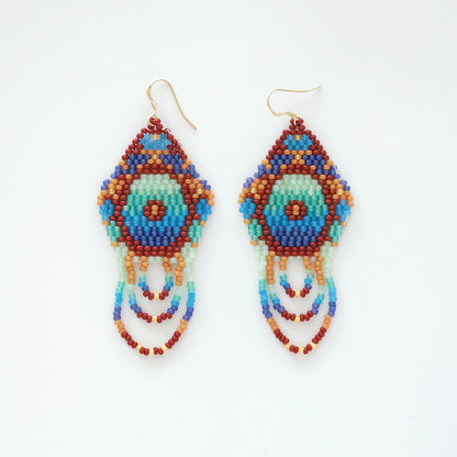 Colorful beaded earrings on a white background