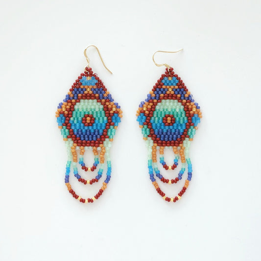 Colorful beaded earrings on a white background